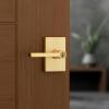 imageKwikset Halifax Interior Privacy Door Handle with Lock Door Lever For Bathroom and Bedroom Matte Black Reversible Keyless Push Button Lock Door Lever with Microban ProtectionSatin Brass