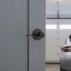 imageKwikset Tustin Entry Door Handle with Lock and Key Secure Keyed Reversible Lever Exterior For Front Entrance and Bedrooms Venetian Bronze Pick Resistant Smartkey Rekey Security and Microban
