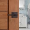 imageKwikset Halifax Vacant Occupied Bathroom Door Handle Lock Privacy Door Lever with Indicator Matte BlackVenetian Bronze